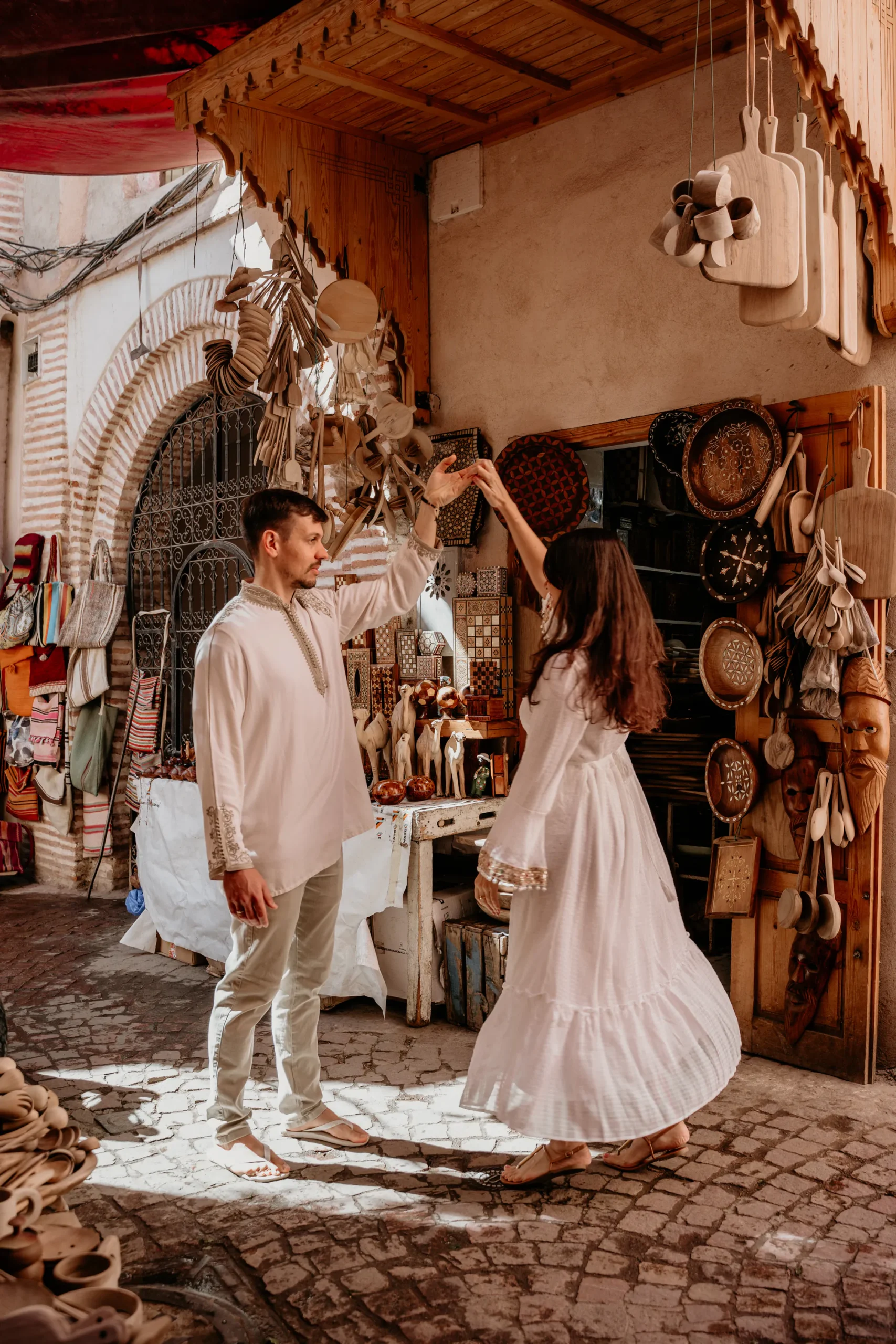 Couple photographed in a riad courtyard with zellige tilework in Marrakech